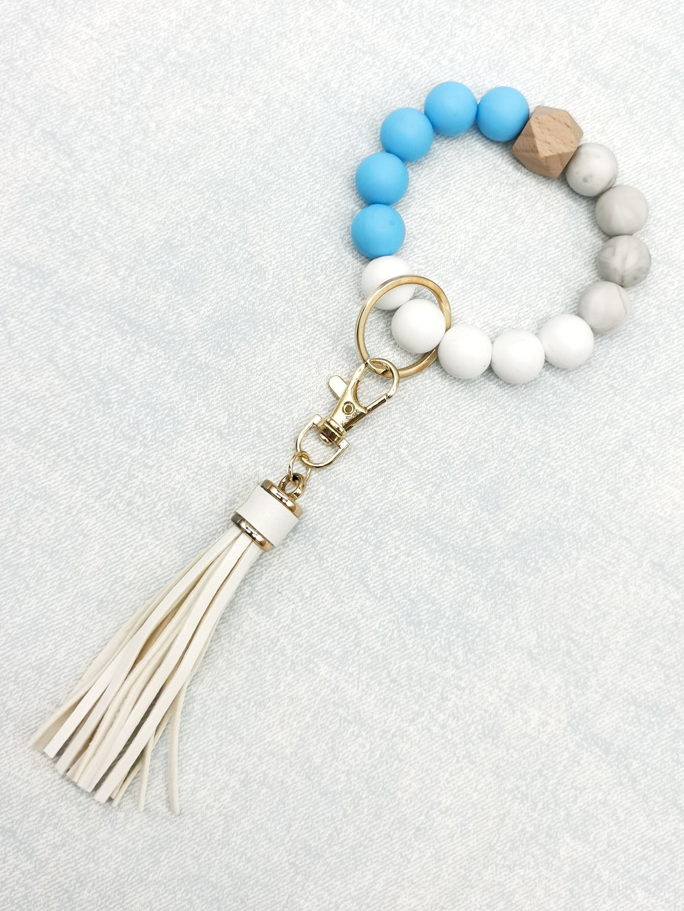 Pulsera de cuentas de silicona con borlas al por mayor llavero de muñeca